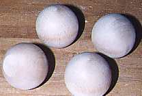 four wooden balls